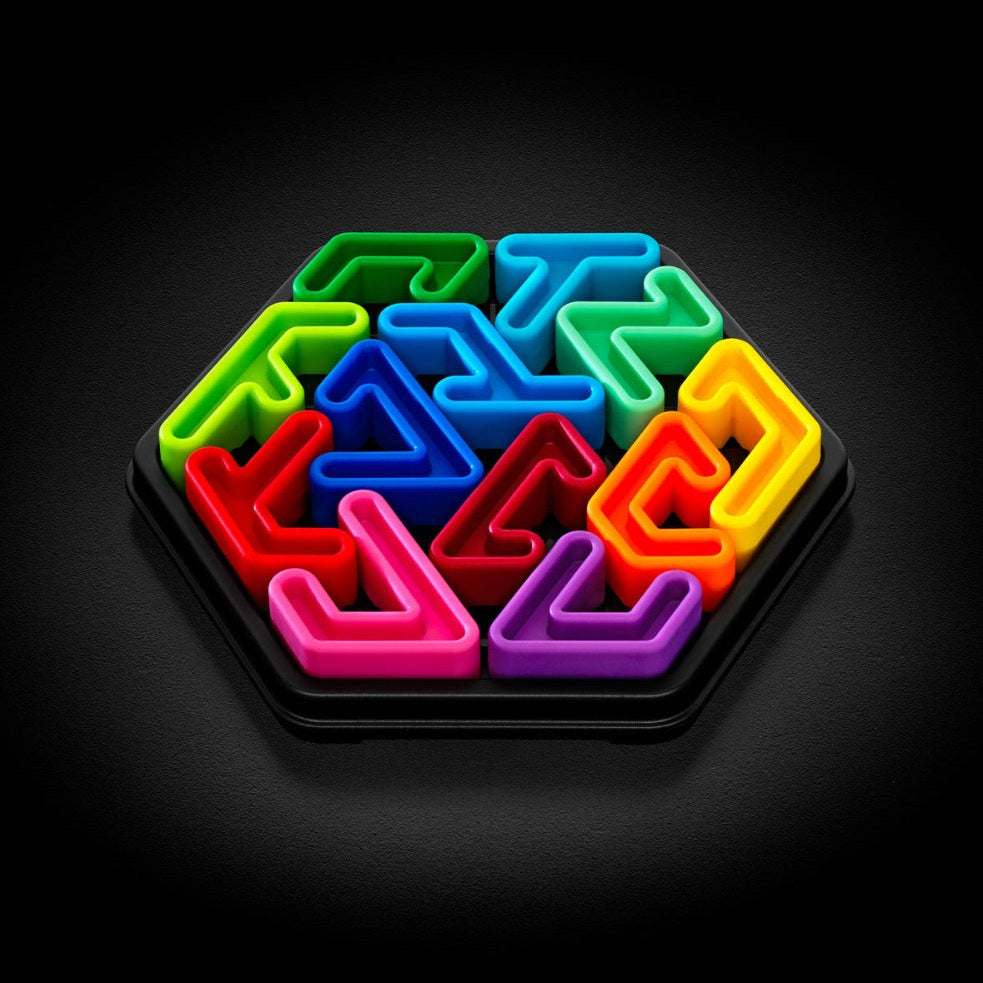 Smart Games IQ Deluxe Hexagon puzzle set with colorful interlocking pieces in a black tray