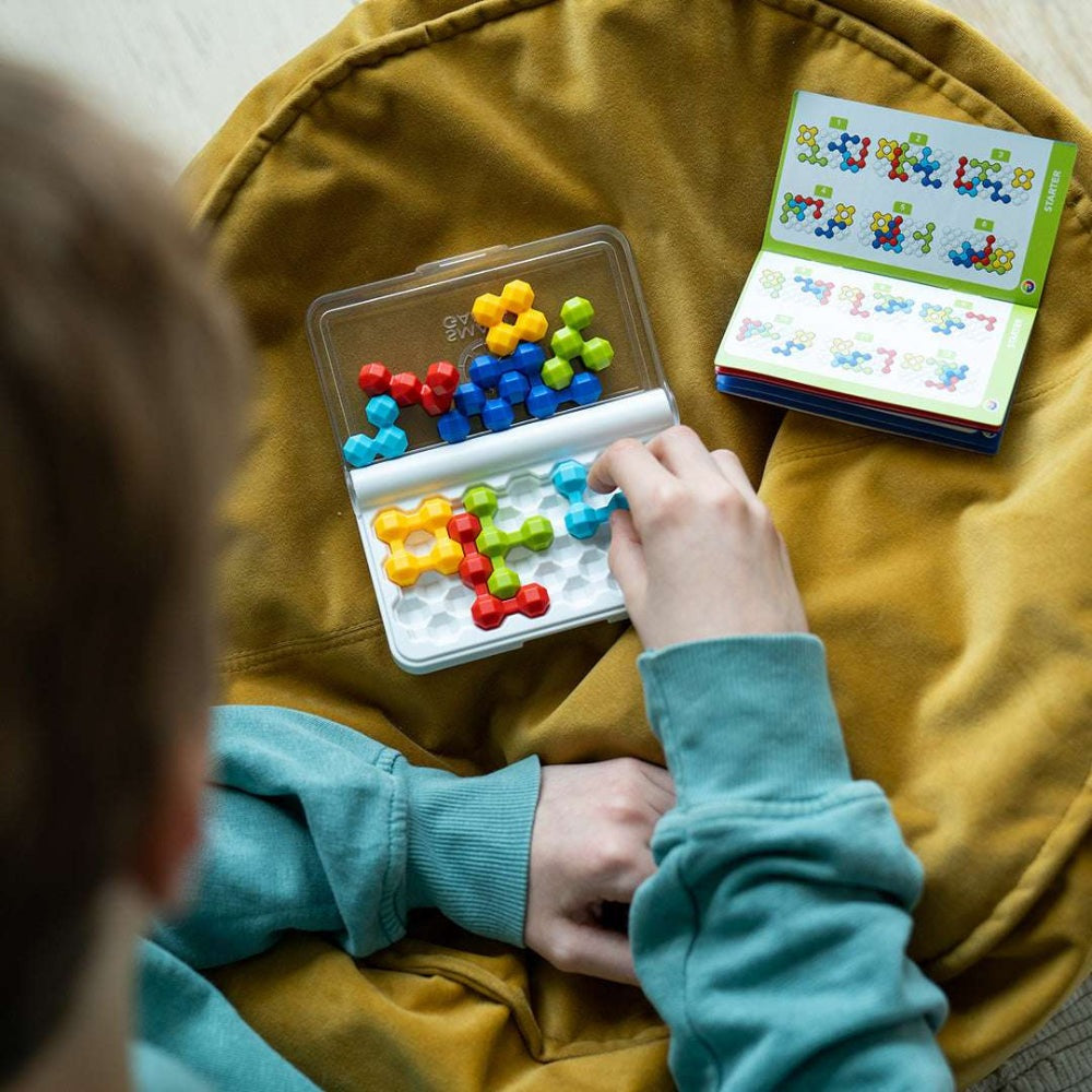 Smart Games IQ Twins puzzle in a travel case with colorful hexagonal pieces for educational play