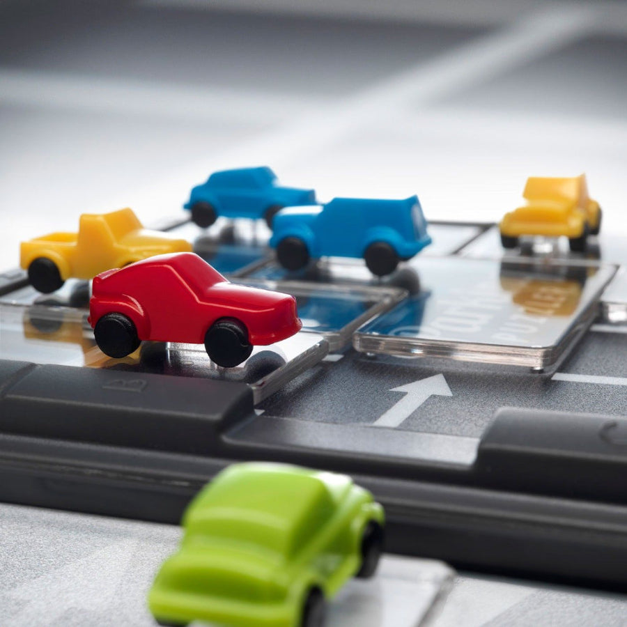 Smart Games Parking Puzzler by SMART GAMES; five colorful plastic cars on a parking grid