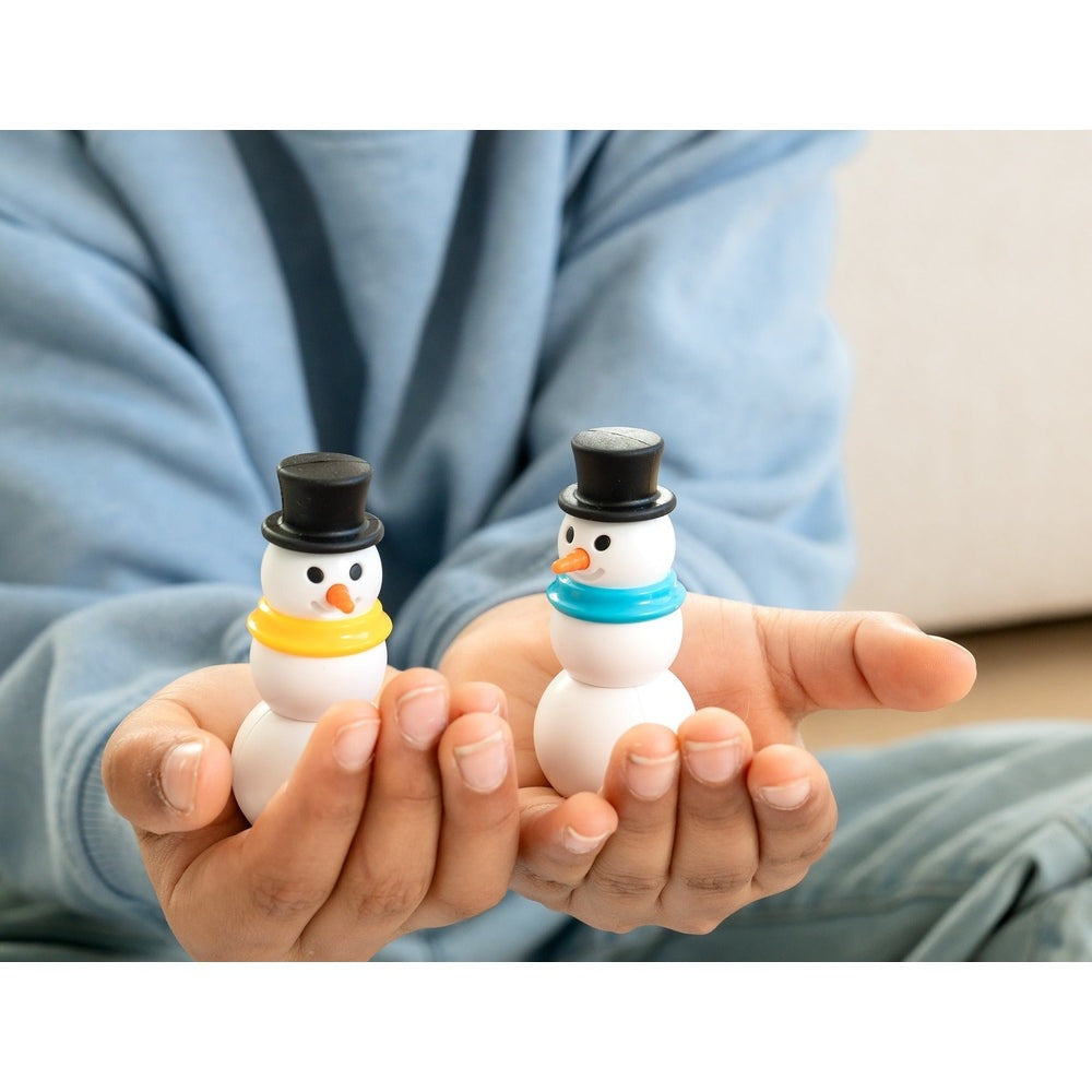 Snow Problem by SMART GAMES; two small plastic snowmen with top hats and yellow/blue scarves held in hands.
