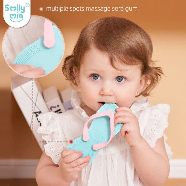 Smily Mia & Dommy flip-flop teether 2-pack; teal with pink strap, baby holding one.