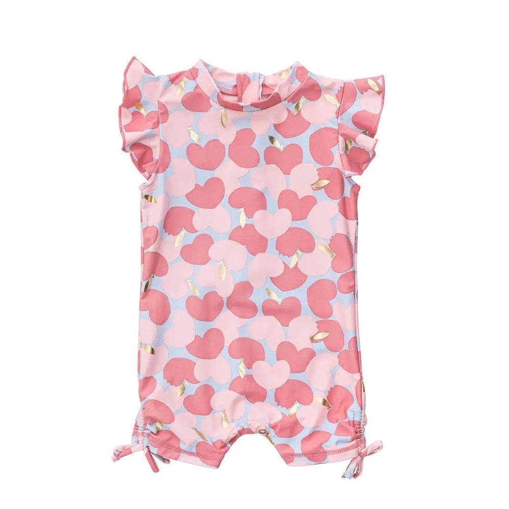 Snapper Rock Apple Love Flutter Sleeve Sunsuit in pink/blue heart print; features ruffle sleeves and tied hems.