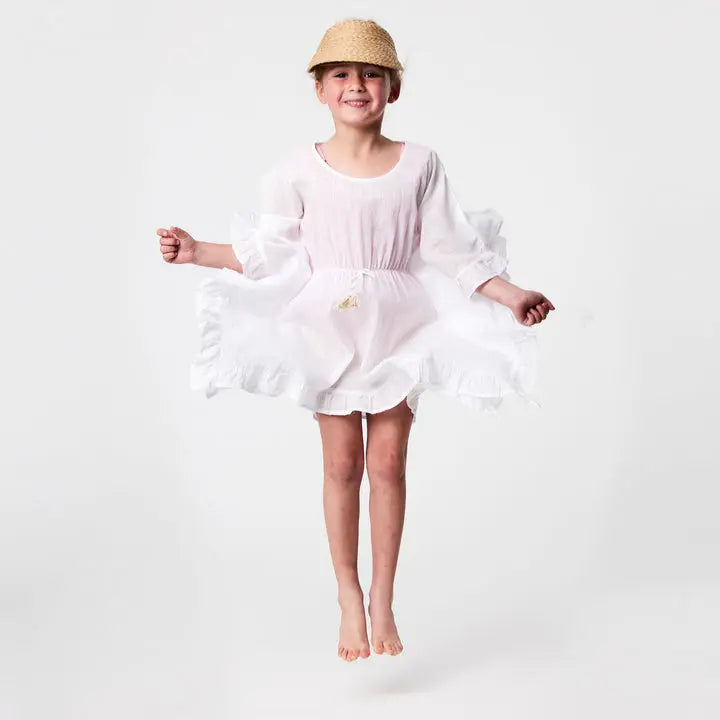 Snapper Rock White Frilled Cover Up for girls, lightweight swim cover-up, girl swirls the ruffled hem while jumping.