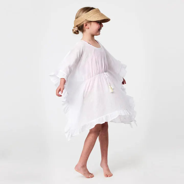 Snapper Rock White Frilled Cover Up worn by a girl; tassel tie and airy layered hem flutter as she moves.