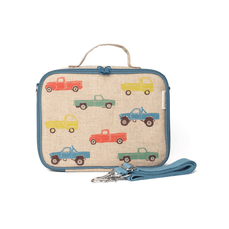 So Young Lunch Box in beige canvas with blue zipper and handle, multicolor truck print; comes with blue shoulder strap