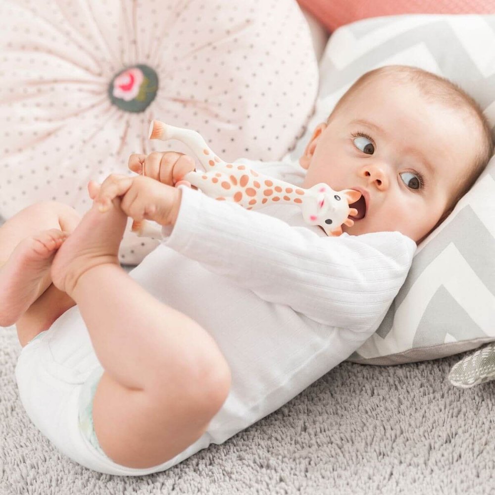 Sophie la Girafe teether; white and orange giraffe baby chew toy
