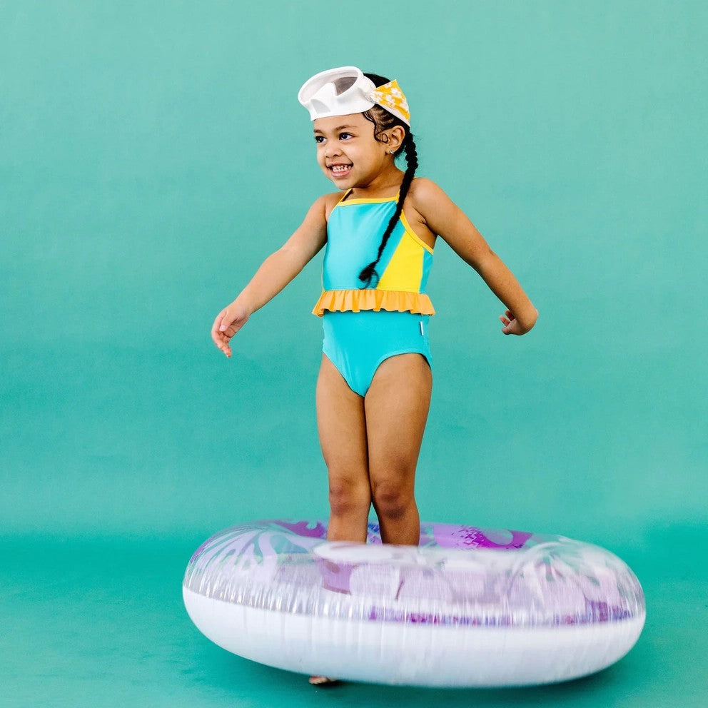 Splash Swim Mask Goggles Daisy Love kid's swim mask; white mask with yellow strap, turquoise swimsuit.