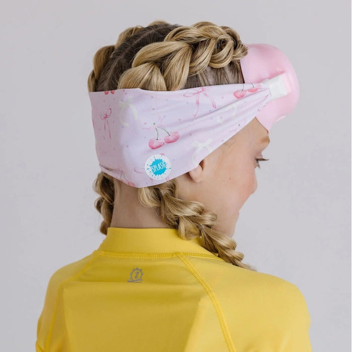 Splash Cherry Charms Youth Swim Mask Goggles in Pink on a girl with braided hair and a yellow rash guard