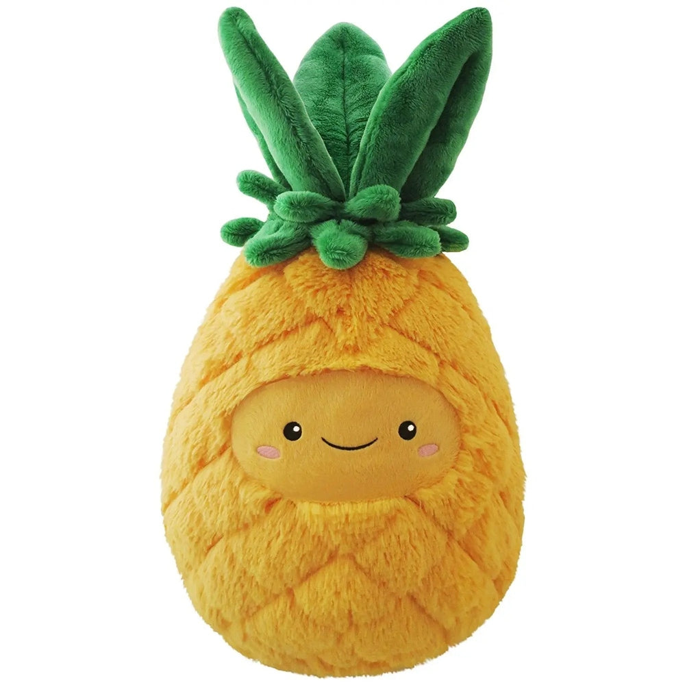 Squishable pineapple plush by STORTZ TOYS, yellow fuzzy body with green leafy crown, smiling and sitting upright.