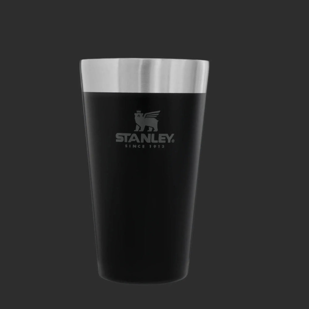 Stanley Adventure Stacking Beer Pint 16 oz stainless steel tumbler in black with silver rim, STANLEY logo visible.