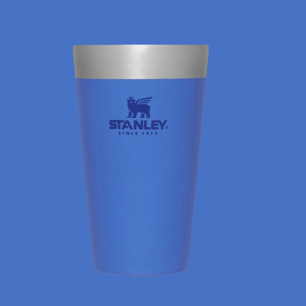 Stanley Adventure Stacking Beer Pint 16 oz blue stainless steel tumbler with silver rim, standing upright with logo visible.