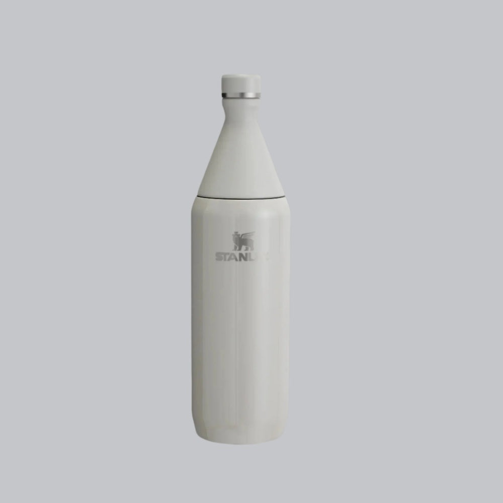 Stanley All Day Slim Bottle 20 oz, white stainless steel shown standing upright with a secure twist-off cap and visible STANLEY logo.