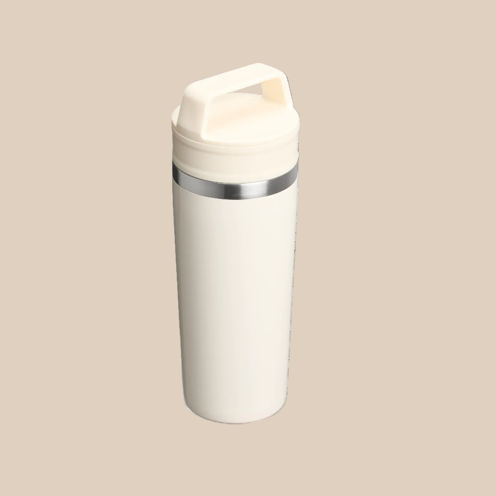 Stanley Cafe-To-Go Travel Mug 16 oz, white with stainless band, standing upright with secure lid for hot drinks.