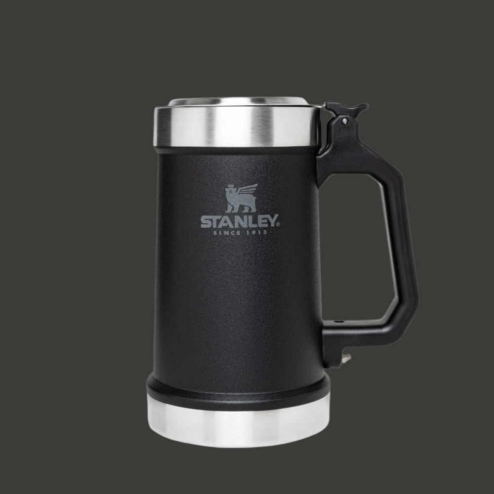 Stanley Classic Bottle Opener Beer Stein 24 oz in black with stainless lid and base, sturdy handle shown.