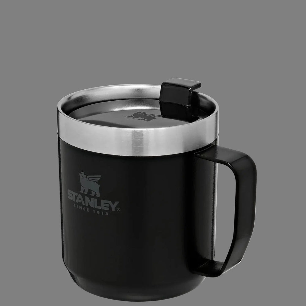 Stanley Classic Stay-Hot Camp Mug 12 oz in black with stainless lid; lid snaps shut to seal in heat.