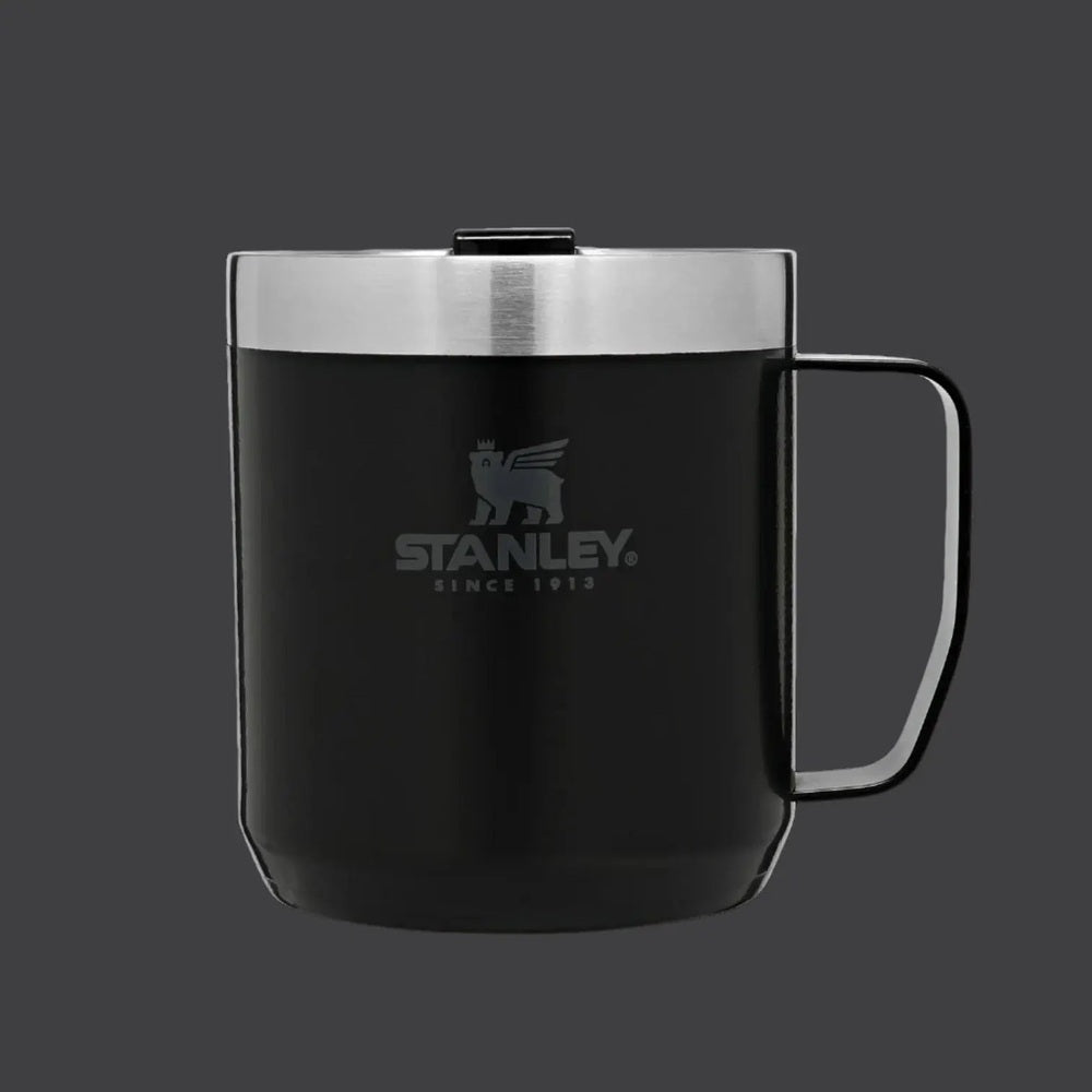 Stanley Classic Stay-Hot Camp Mug 12 oz in black with stainless steel lid; lid closed, secure spill-proof design.