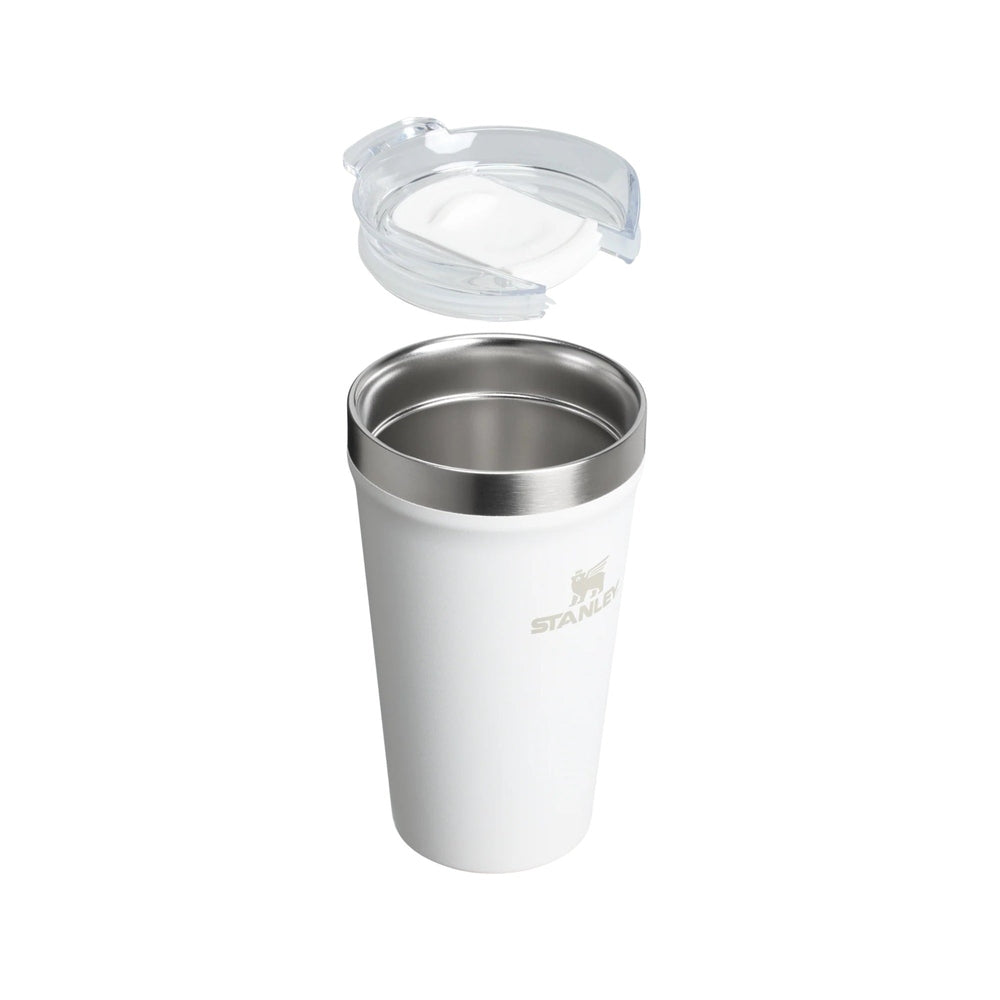 Stanley Everyday Tumbler 16oz in white with stainless rim, clear lid lifted above the cup.