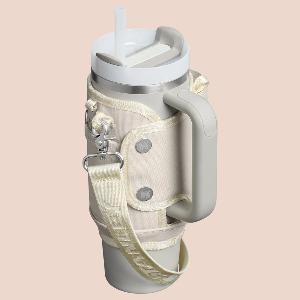 Stanley All Day Quencher Carry-All 30 oz insulated water bottle with cream strap and handle