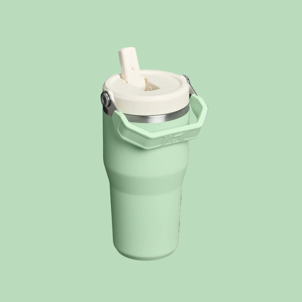 STANLEY The Iceflow Flip Straw 2.0 Tumbler 20 oz in mint green, flip straw ready for sipping.