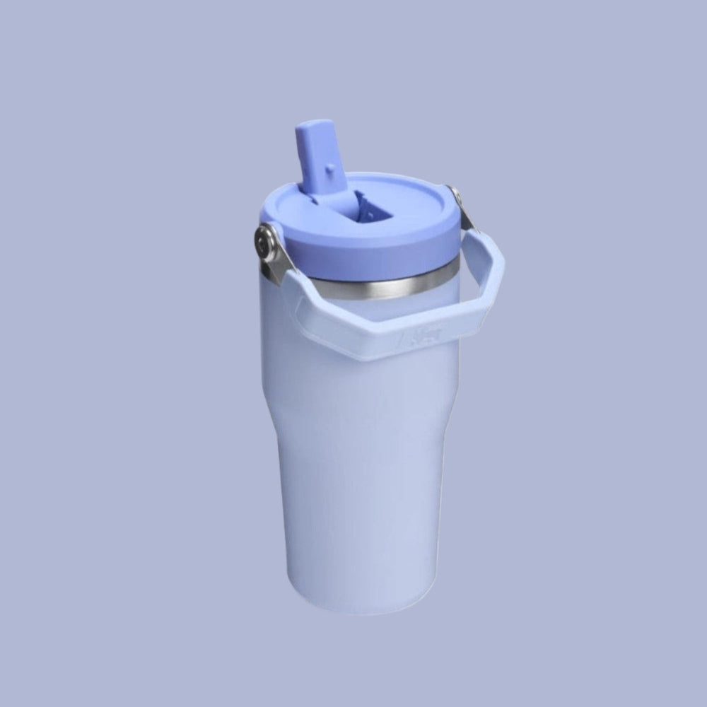 STANLEY The Iceflow Flip Straw 2.0 Tumbler 20 oz in light blue, showing the flip straw lid and sturdy carry handle.