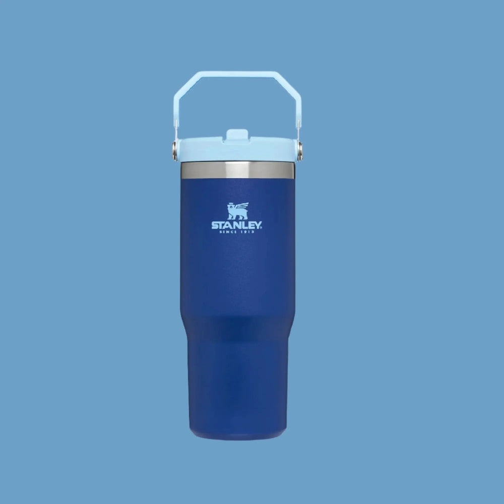 Stanley The Iceflow Flip Straw Tumbler 30 oz blue with light-blue lid; built-in handle shown for easy carrying.