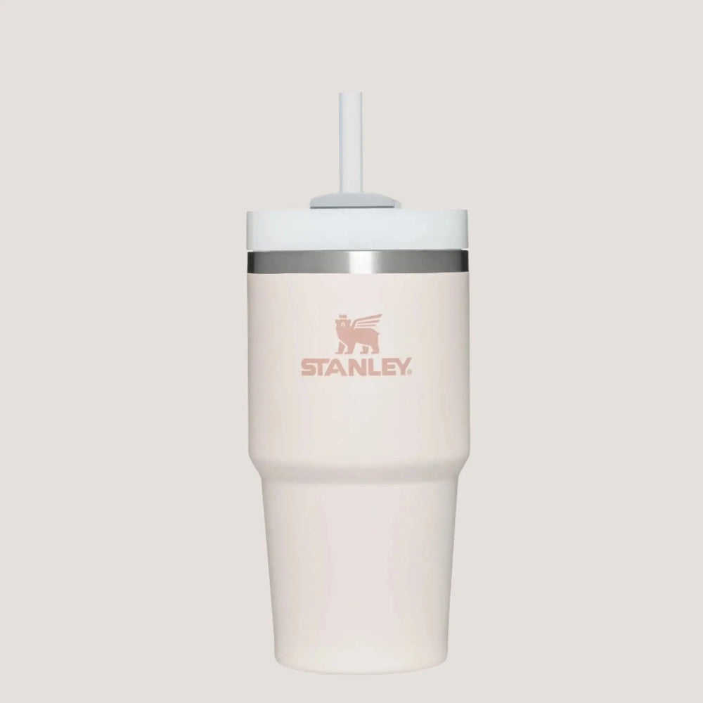 Stanley The Quencher H2.0 Flowstate 20 oz tumbler, pale pink with white lid and straw, ready for on-the-go hydration