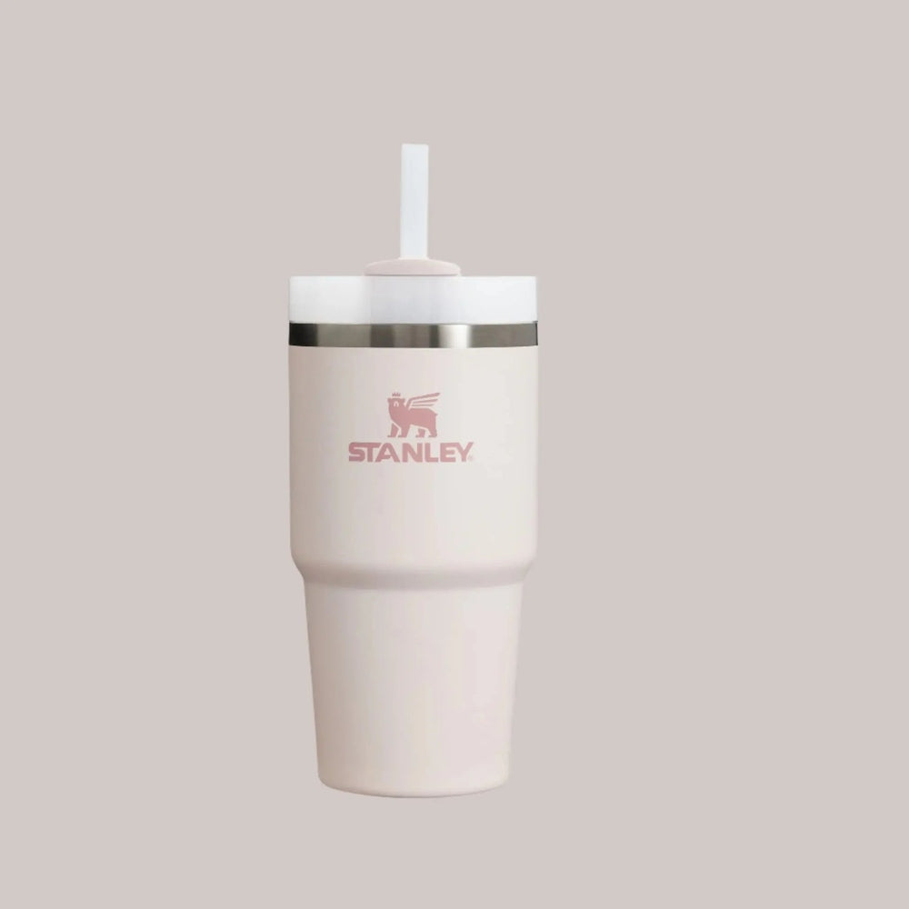 Stanley The Quencher H2.0 Flowstate 20 oz tumbler in blush pink with white lid and extended straw