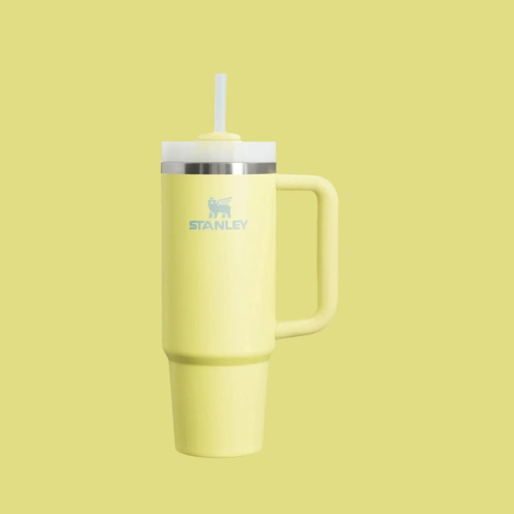 Stanley The Quencher H2.0 Flowstate Tumbler 30 oz in yellow with white lid and straw ready for sipping.