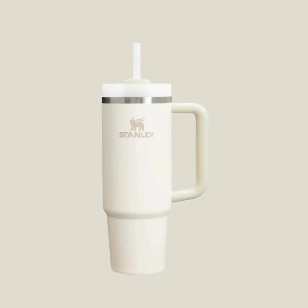 Stanley The Quencher H2.0 Flowstate Tumbler 30 oz white with straw and handle, standing upright.