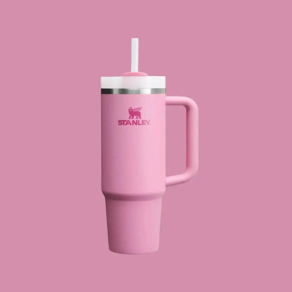 Stanley The Quencher H2.0 Flowstate Tumbler 30 oz in pink with straw, lid, and ergonomic handle.