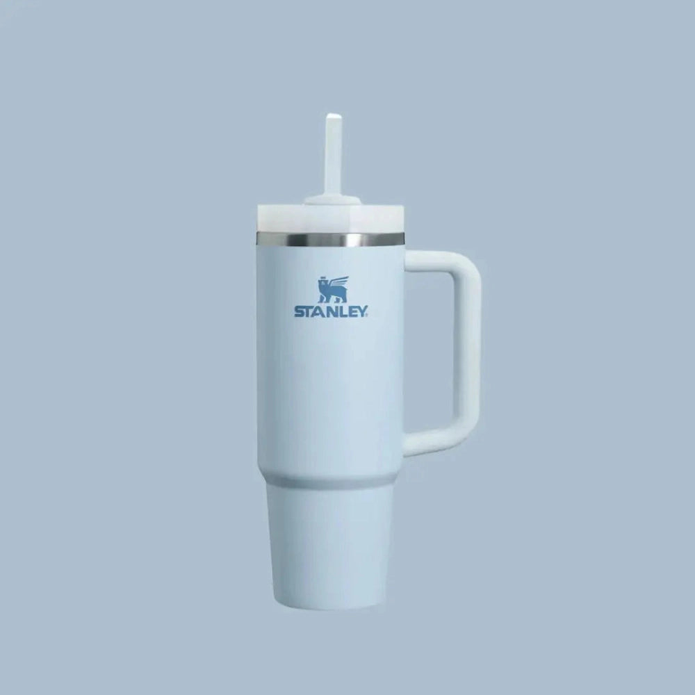 Stanley The Quencher H2.0 Flowstate Tumbler 30 oz in light blue with straw lid and handle ready to sip