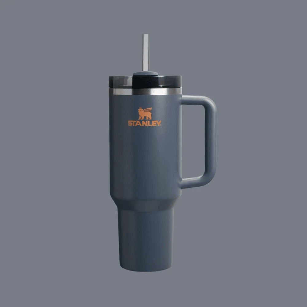 Stanley The Quencher H2.0 Flowstate Tumbler 40 oz in blue-gray with handle; straw shows sip-through lid.