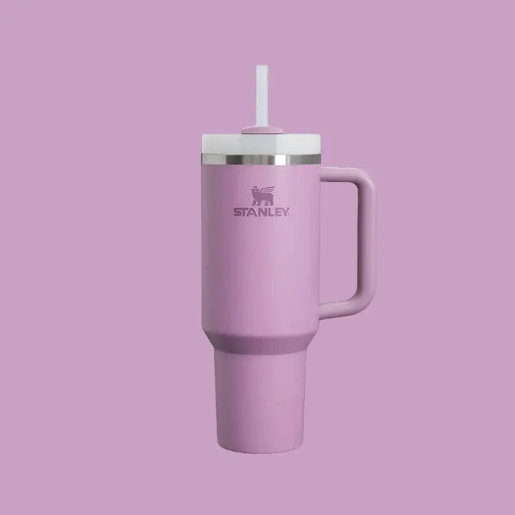 Stanley The Quencher H2.0 Flowstate 40 oz tumbler in pink with straw extended and side handle