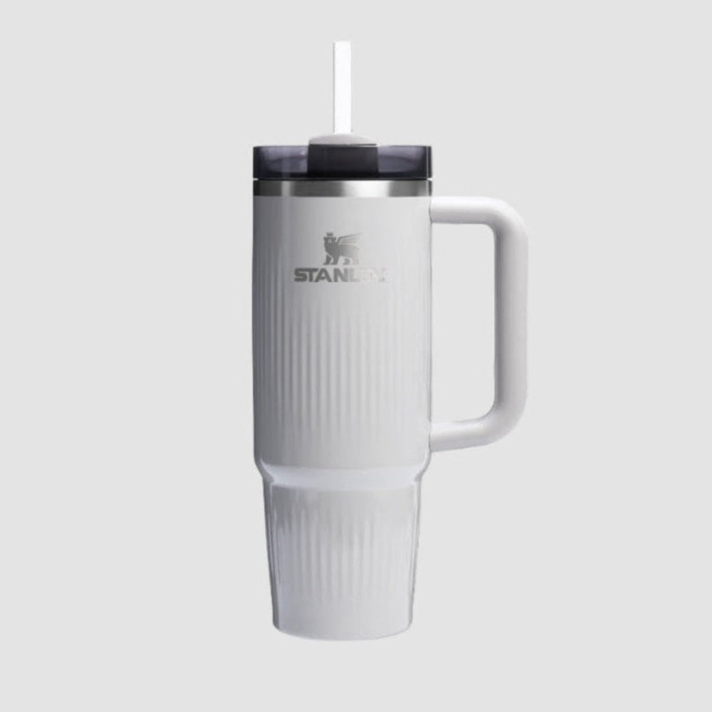 Stanley The Quencher H2.0 Fluted Tumbler 30 oz white with straw lid and side handle, ribbed for grip.