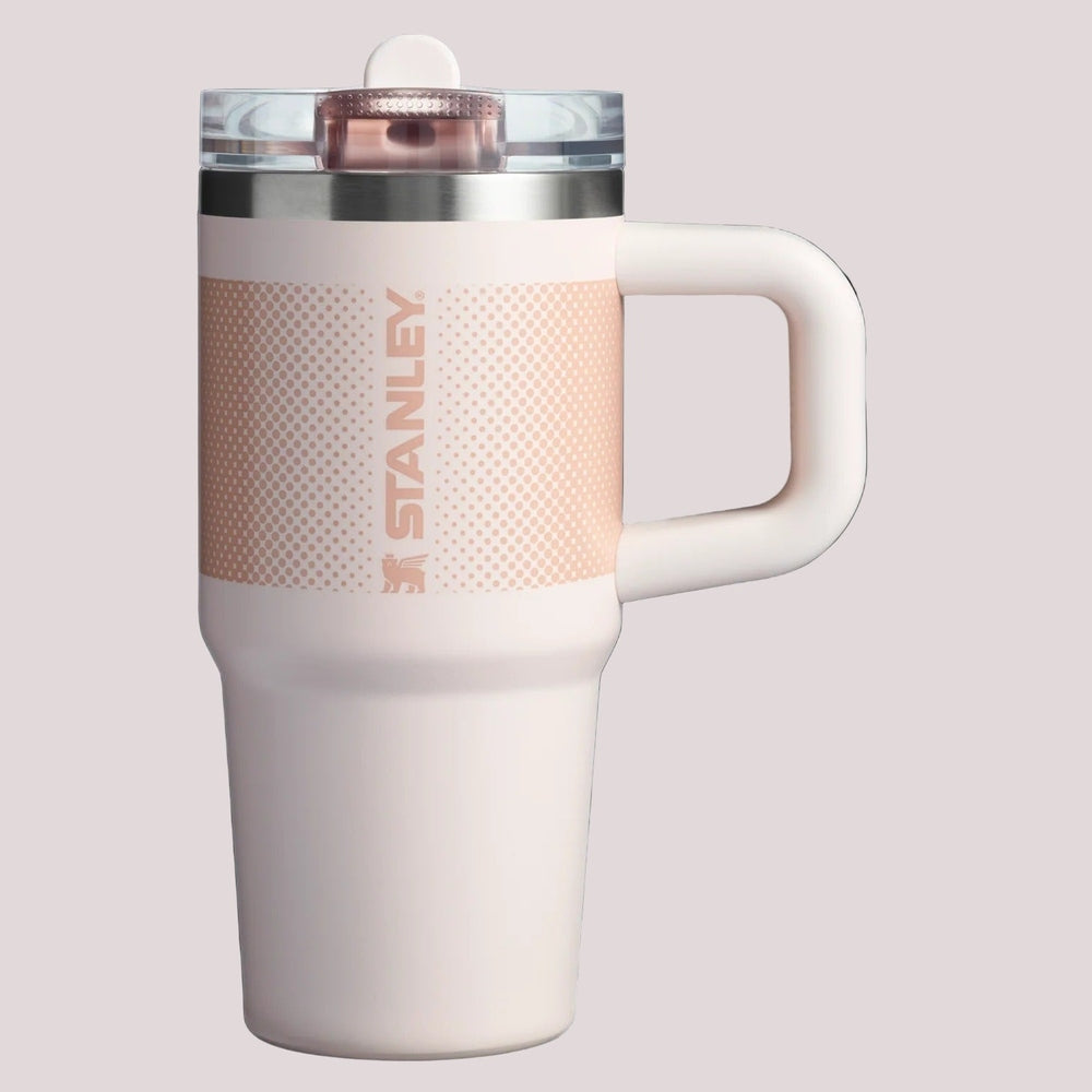 Stanley The Quencher Protour Flip Straw Tumbler 14 oz in blush pink with white handle, lid open to reveal straw.
