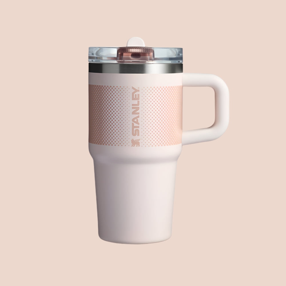Stanley The Quencher Protour Flip Straw Tumbler 20 oz in pale pink with white handle and flip straw lid