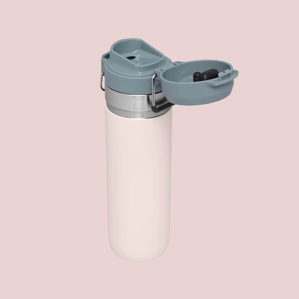 Stanley The Quick Flip GO Bottle 24 oz with gray flip-top lid open, revealing spill-proof spout.