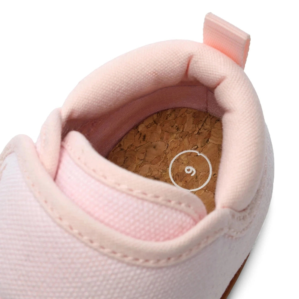 Stonz Cruiser Natural baby shoes haze pink; soft fabric upper with cork insole, shown with a foot inside.