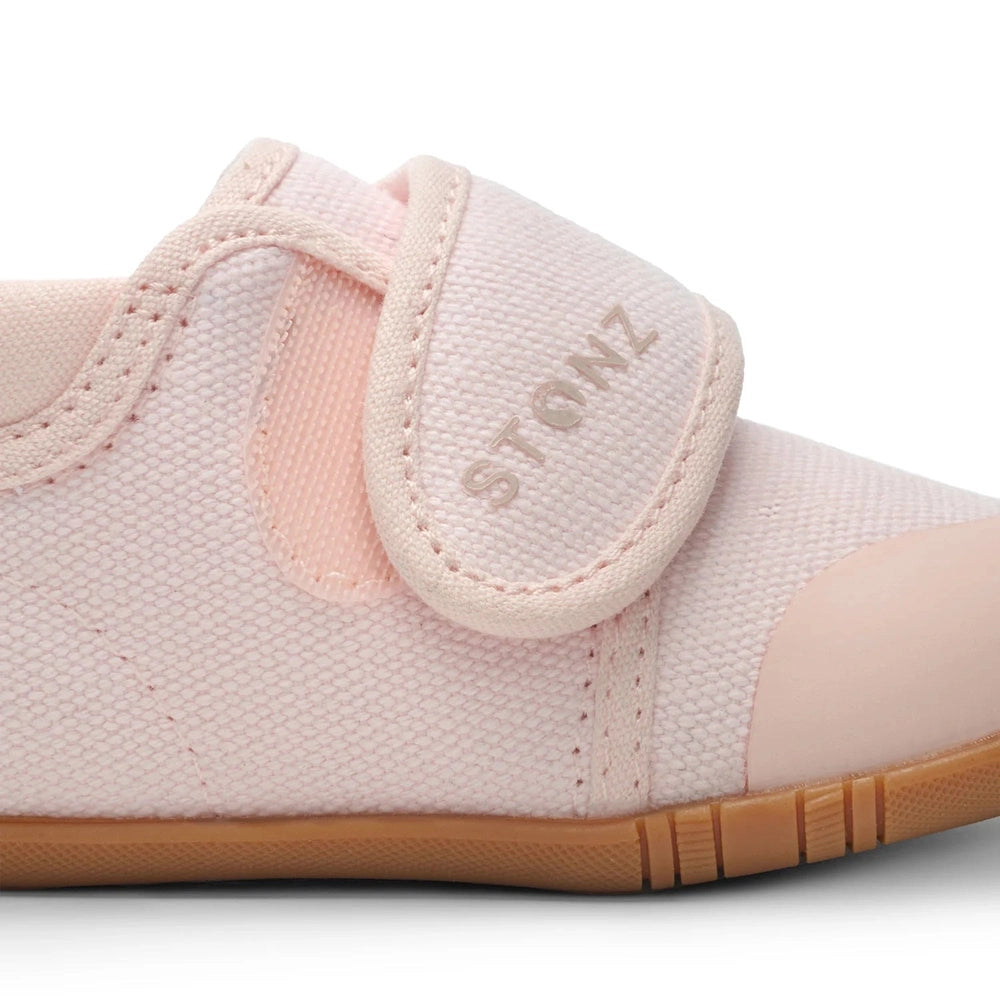 Stonz Cruiser Natural Baby Shoes Haze Pink, pink canvas with Velcro strap fastened over a tan rubber sole.