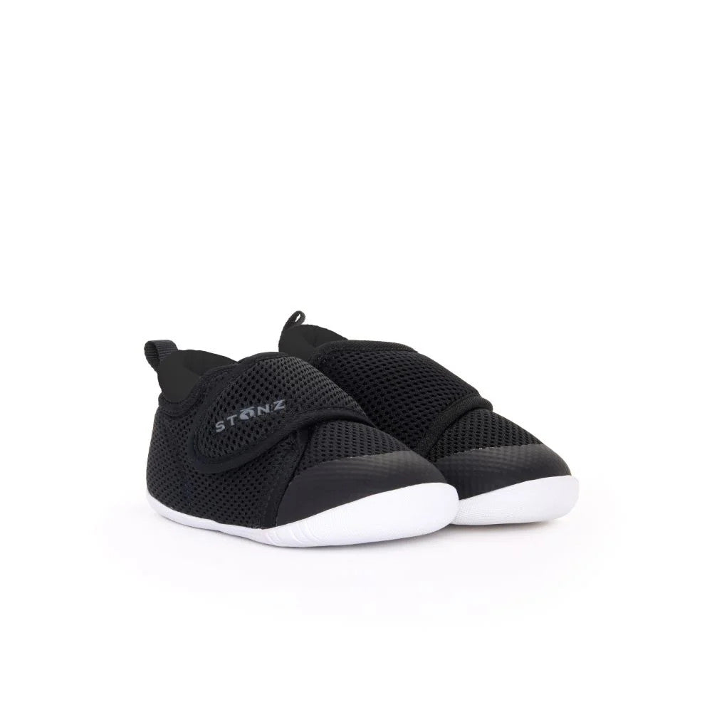 Stonz Cruiser Original Baby Shoes Black with breathable mesh upper and Velcro strap secured, white sole.