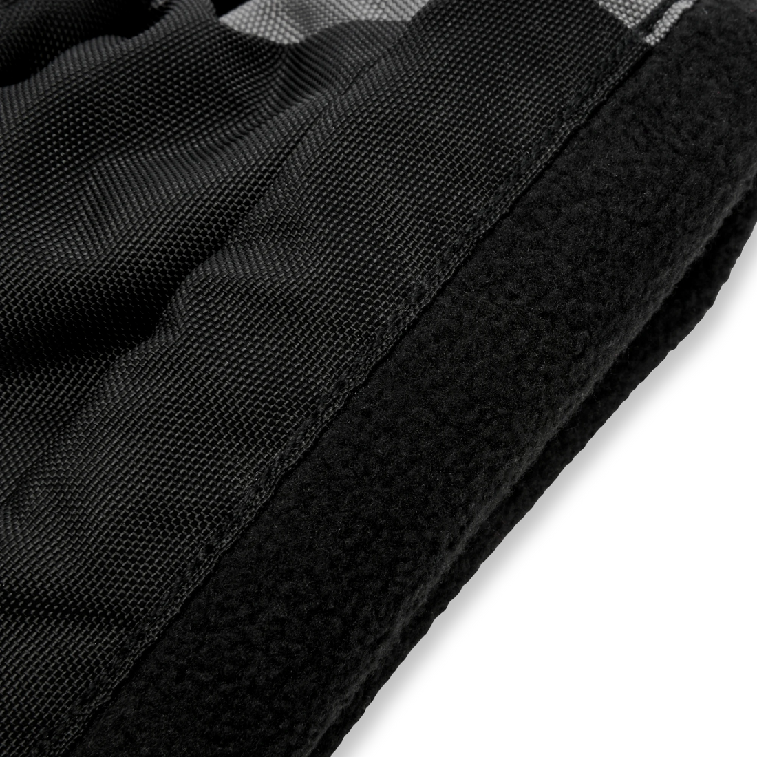 Close-up of the fabric texture and soft panel on a Stonz Black/Grey Snow Mitt.