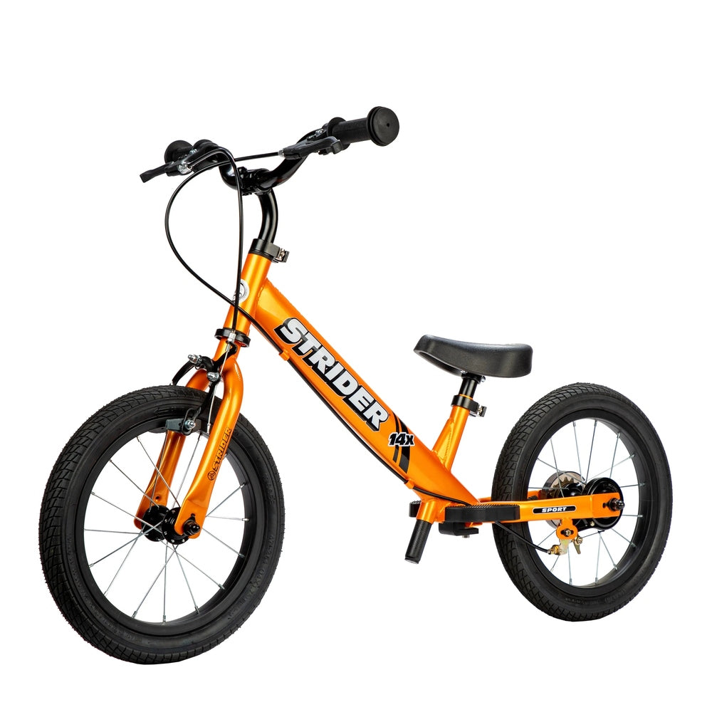Strider 14X Sport balance bike in bright orange with black handlebars, demonstrating pedal-free riding.