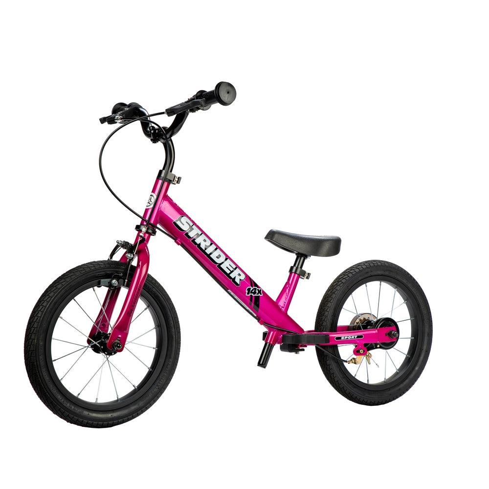 Strider 14X Sport Balance Bike in pink with black saddle and tires, ready for a ride.