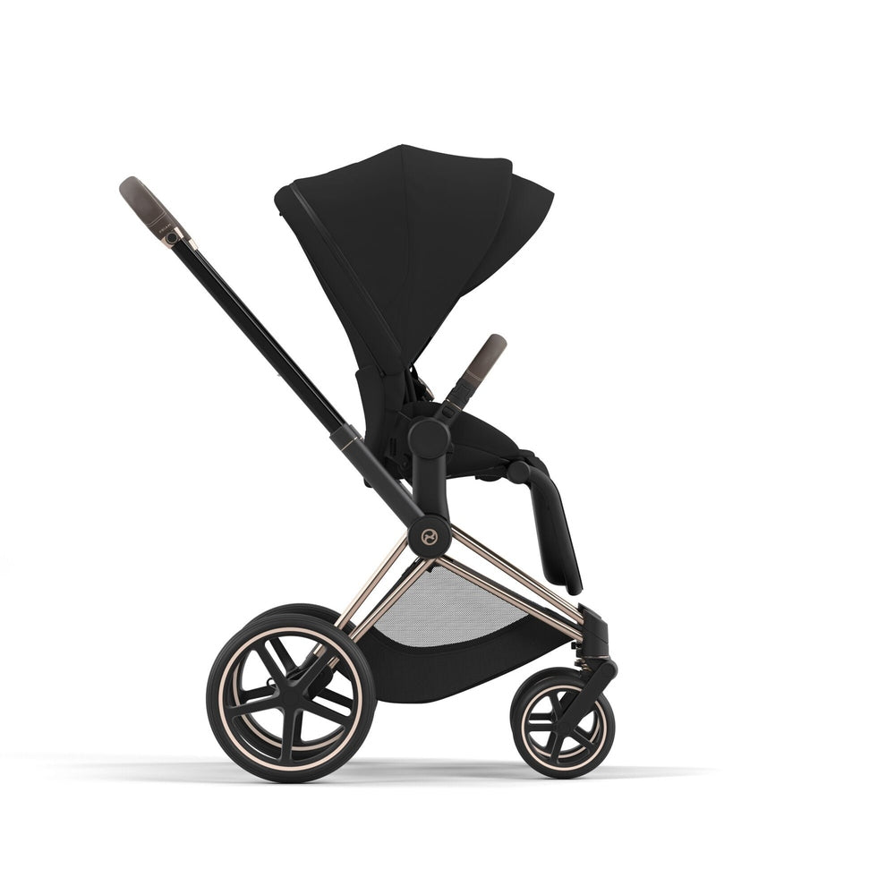 Studio product image of the Cybex Platinum Priam 4 Luxury Stroller One Box Pack in Sepia Black with Rose Gold Brown frame, side profile on white background.