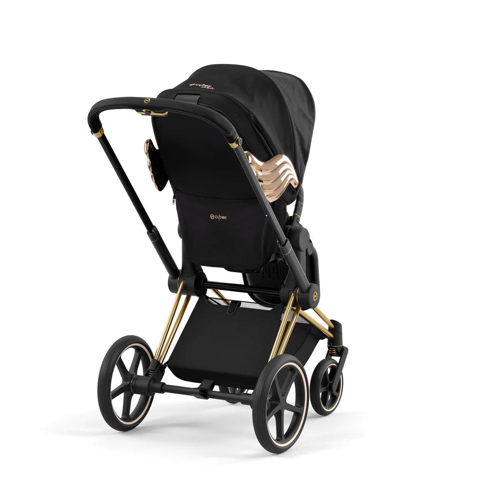 Studio product image of the Cybex Platinum Priam Stroller Jeremy Scott Wings edition in black with gold wing accents.