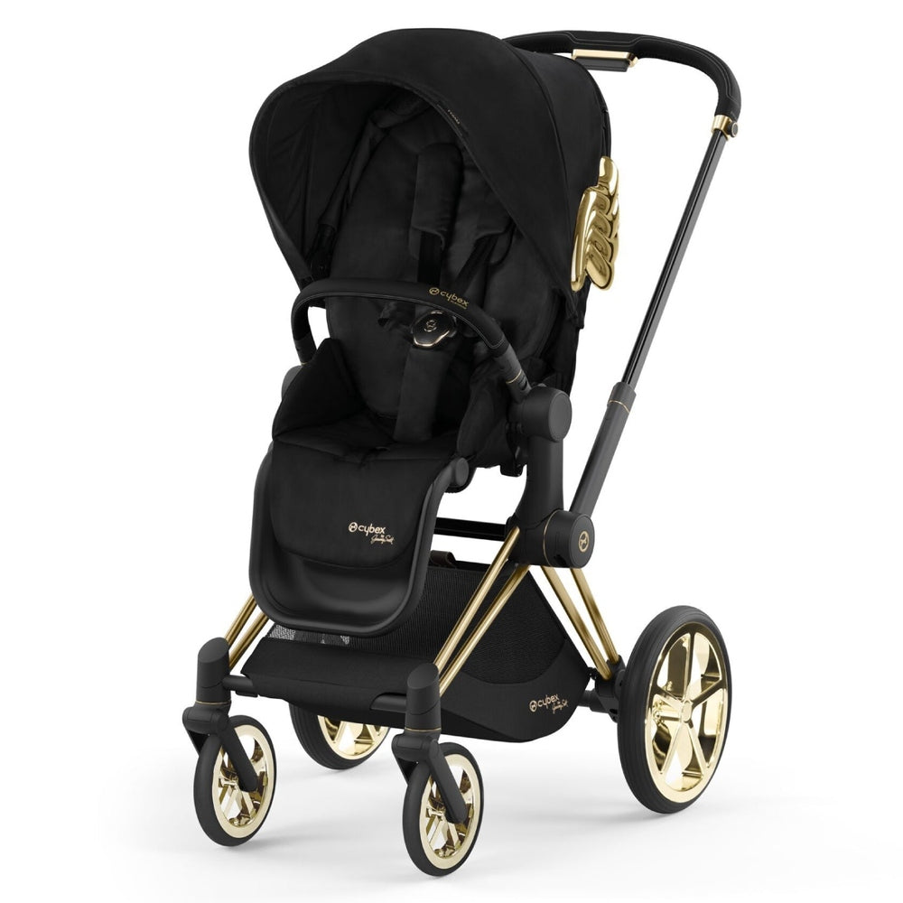 Studio product image of the Cybex Platinum Priam Stroller Jeremy Scott Wings in black with gold frame, front three-quarter view on white background.