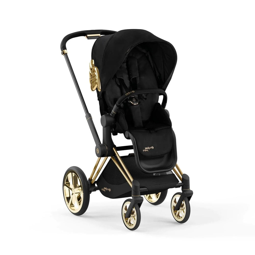 Studio product image of the Cybex Platinum Priam Stroller Jeremy Scott Wings in black with gold-tone frame and gold accents on white background.