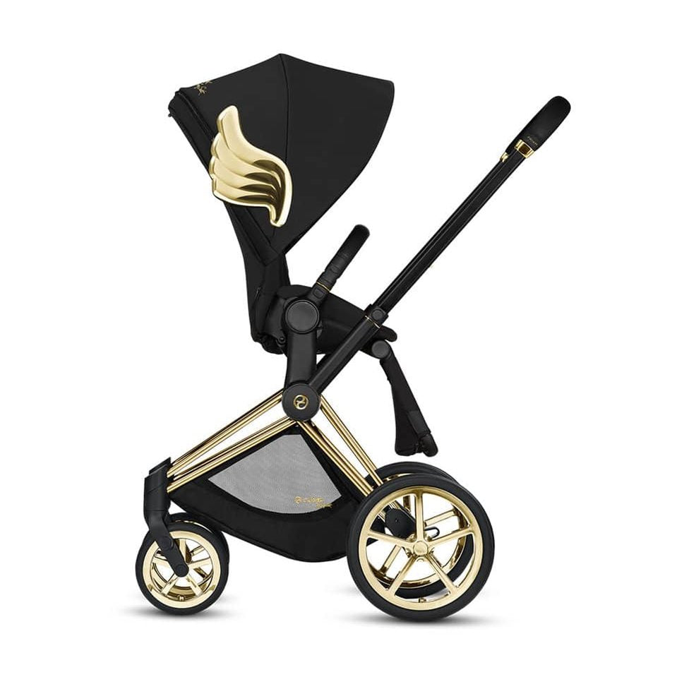Studio product image of the Cybex Platinum Priam Stroller Jeremy Scott Wings in black with gold wing accents, side profile on white background.
