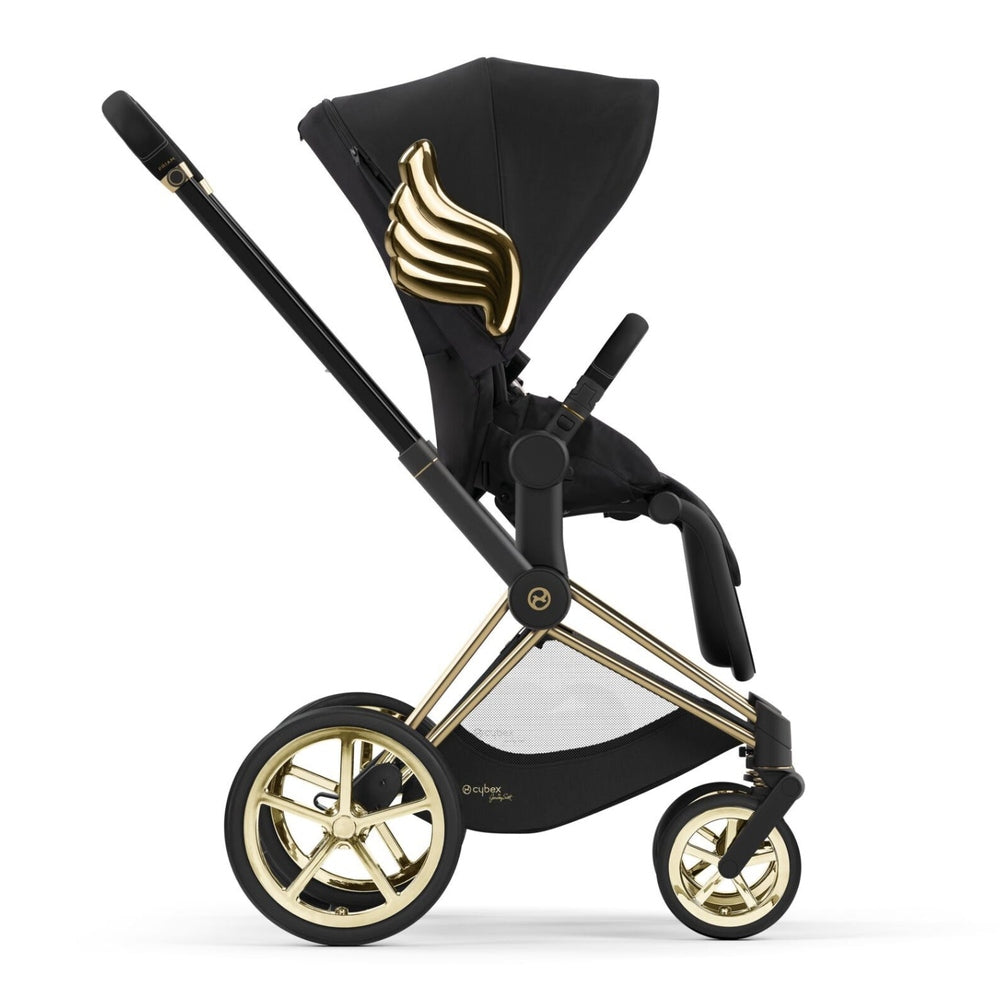 Studio product image of the Cybex Platinum Priam Stroller Jeremy Scott Wings in cybex priam with Jeremy Scott Wings in black and gold on white background.