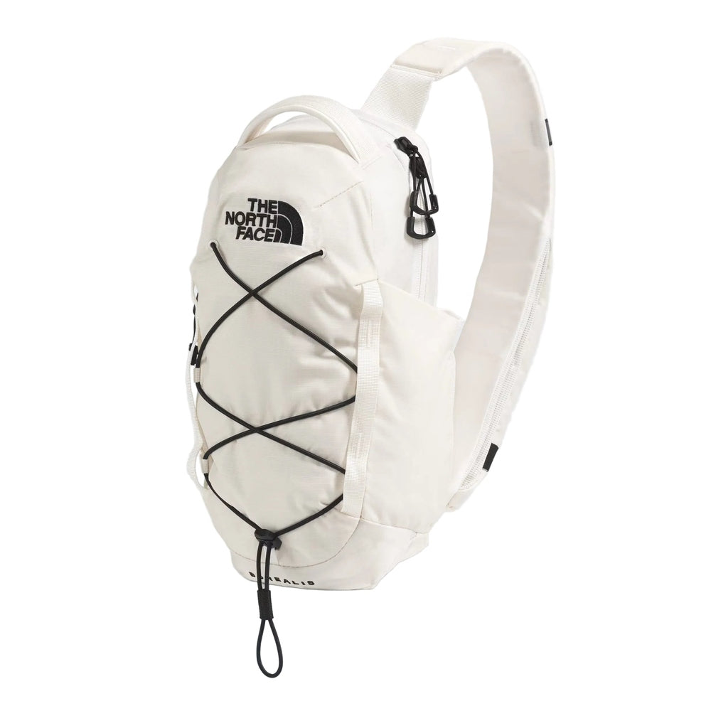 The North Face Borealis Sling Backpack in Cream White with black bungee cords